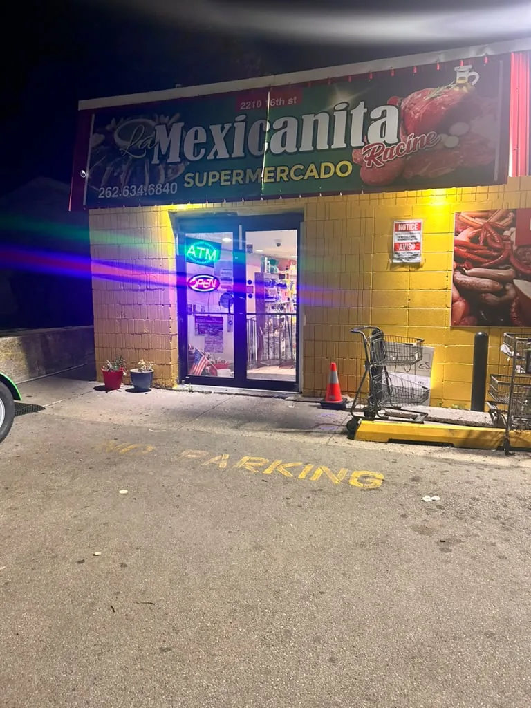Front entrance of La Mexicanita Supermercado at night